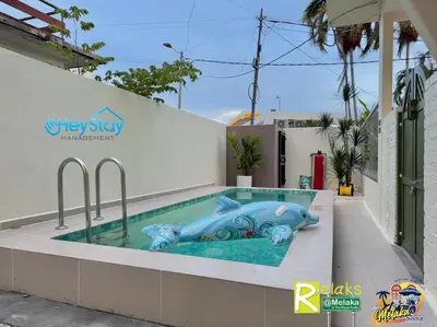 a pool with a fish in the middle of a building at MalayaVilla 5R3B16Pax PrivatePool Karaok PlayGround in Gua Sai