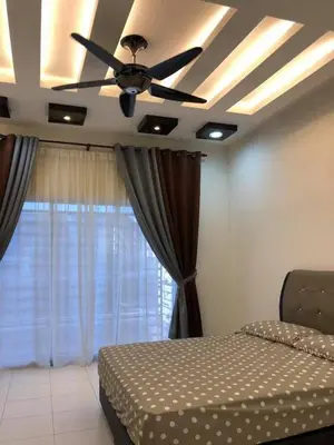 a bedroom with a ceiling fan and a bed at Casa Innova Homestay, Bertam Penang in Kepala Batas
