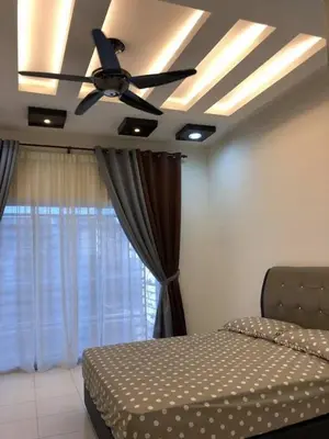 a bedroom with a bed and a ceiling fan at Casa Innova Homestay, Bertam Penang in Kepala Batas
