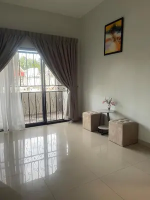 a living room with a large window and a table at Ipoh Calm Corner in Ipoh