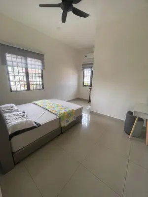 a bedroom with a bed and a ceiling fan at Ipoh Calm Corner in Ipoh