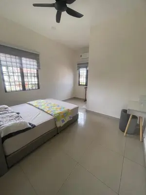 a bedroom with a bed and a ceiling fan at Ipoh Calm Corner in Ipoh