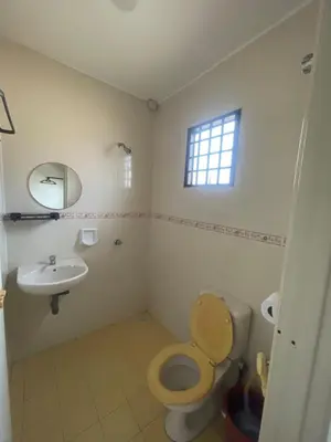 a bathroom with a toilet and a sink at Ipoh Calm Corner in Ipoh