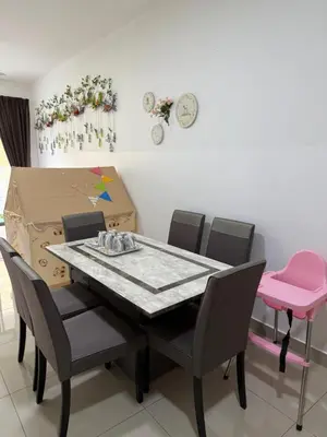 a dining room with a table and chairs and a box at Palas Horizon Home A-6-15 in Brinchang