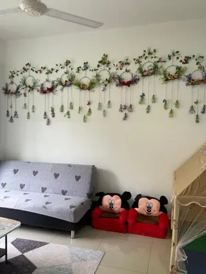 two teddy bears sitting on beds in a living room at Palas Horizon Home A-6-15 in Brinchang