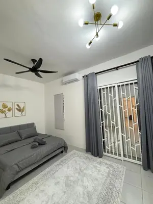 a bedroom with a bed and a ceiling fan at NAZS Homestay 4 bilik tidur 3 bilik air in Sungai Petani