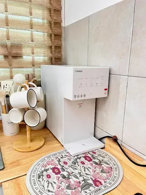 a kitchen with a sewing machine and a rug at NAZS Homestay 4 bilik tidur 3 bilik air in Sungai Petani