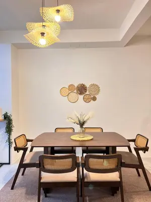 a dining room with a wooden table and chairs at NAZS Homestay 4 bilik tidur 3 bilik air in Sungai Petani