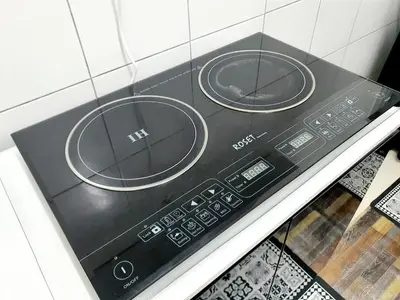 a microwave oven with two dials on top of it at Awan Homestay Cameron Highlands in Tanah Rata