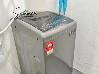 a washing machine sitting next to a wall at CAMERON HIGHLAND Homestay 1 min To Pasar Malam Brinchang By SummerStay 4 - 5pax in Brinchang