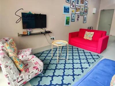 a living room with two chairs and a red couch at CAMERON HIGHLAND Homestay 1 min To Pasar Malam Brinchang By SummerStay 4 - 5pax in Brinchang
