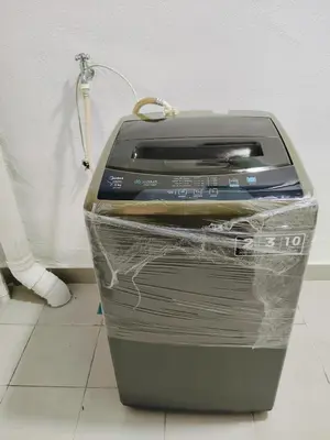 a printer sitting on top of a trash can at Ryhan-Cha Homestay near Afamosa Waterpark in Gua Sai