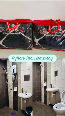 a bathroom with two sinks and two bags of trash at Ryhan-Cha Homestay near Afamosa Waterpark in Gua Sai