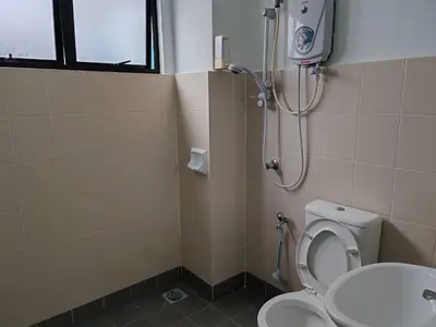 a bathroom with a shower with a toilet and a sink at Pangkor Lot10 Vacation Studio in Pangkor