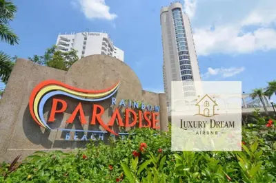 a sign at the park paradise beach with a building at Luxury Dream Seaview in Tanjung Bungah