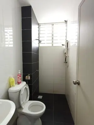 a bathroom with a toilet and a sink and a shower at Bertam Perdana Homestay