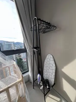 a room with a tennis racket rack next to a window at NEW Georgetown 22 Macalisterz Elegant 2BR 5pax in George Town