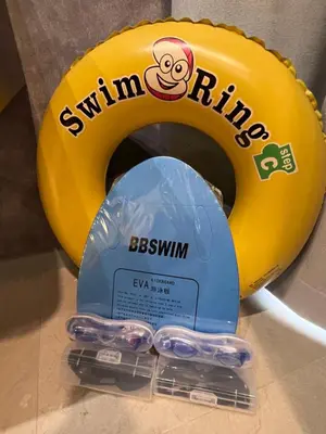 a yellow swimming ring with three swimlins at NEW Georgetown 22 Macalisterz Elegant 2BR 5pax in George Town