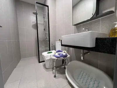 a bathroom with a shower and a sink and a toilet at NEW Georgetown 22 Macalisterz Elegant 2BR 5pax in George Town