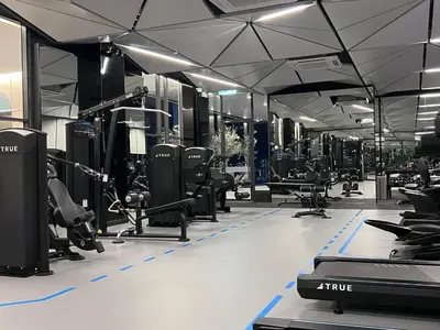 a gym with rows of treadmills and machines at NEW Georgetown 22 Macalisterz Elegant 2BR 5pax in George Town
