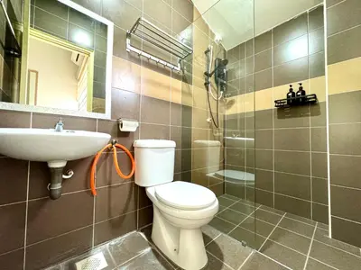 a bathroom with a toilet and a sink at Klebang Cozy Homestay in Chemor