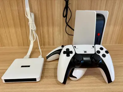 a nintendo wii game controller next to a laptop at Klebang Cozy Homestay in Chemor
