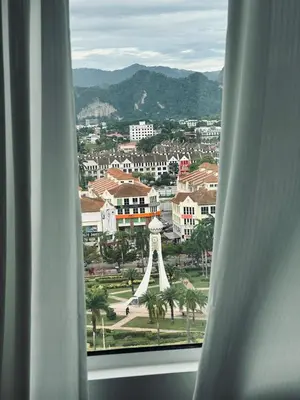 a view of the eiffel tower from a window at Ipoh city view Luxury suites near Ipoh Parade in Ipoh