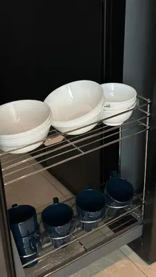 a shelf with four plates and bowls and pans at Ipoh city view Luxury suites near Ipoh Parade in Ipoh