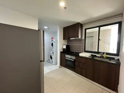 a kitchen with a sink and a microwave at Spacious Comfy 8pax, 3 Bedroom, 2 Car Park, The Landmark in Tanjong Tokong