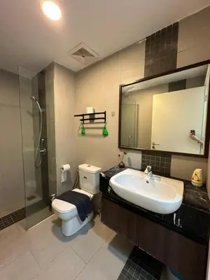 a bathroom with a sink and a toilet and a shower at Spacious Comfy 8pax, 3 Bedroom, 2 Car Park, The Landmark in Tanjong Tokong