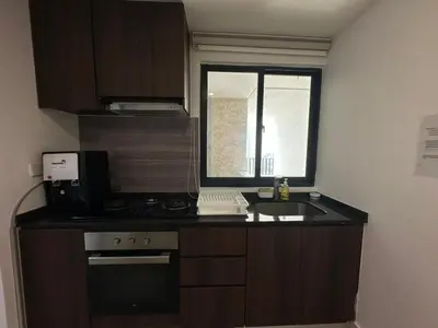 a small kitchen with a sink and a window at Spacious Comfy 8pax, 3 Bedroom, 2 Car Park, The Landmark in Tanjong Tokong