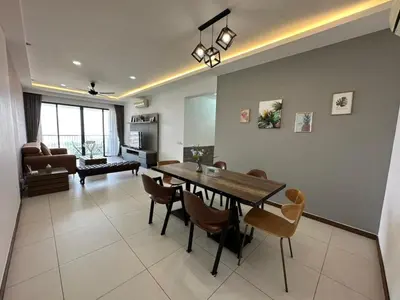 a living room with a dining room table and chairs at Spacious Comfy 8pax, 3 Bedroom, 2 Car Park, The Landmark in Tanjong Tokong