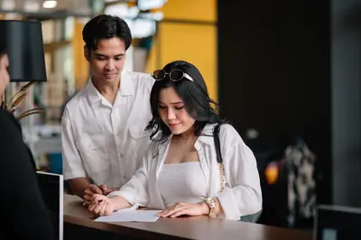 a man and a woman sitting at a table at 22 Macalisterz George Town By Mana-Mana in George Town