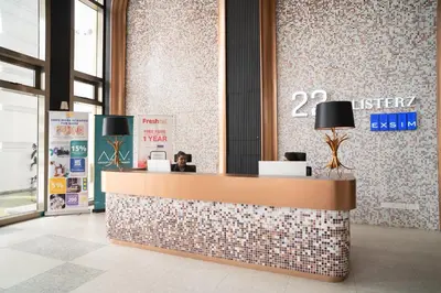 a lobby with a reception desk in a building at 22 Macalisterz George Town By Mana-Mana in George Town
