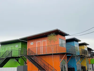 a row of colorful houses with balconies at 69 Comfortainer Homestay in Taiping