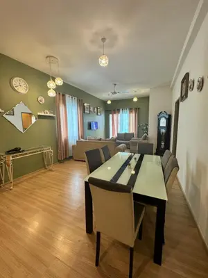 a dining room and living room with a table and chairs at AYAAN Luxe Premium FIFA house with Free WiFi and Netflix in Tanah Rata