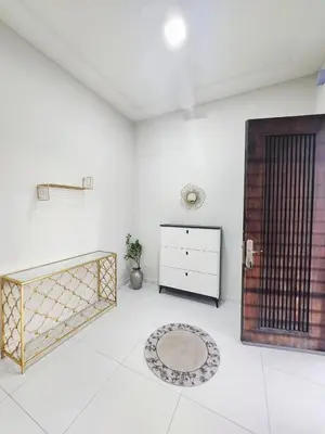 a white room with a gate and a dresser at Ipoh Seri Botani 5br22 pax bbq mahjong in Kampong Kepayang