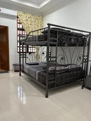a couple of bunk beds in a room at Bidor Homestay in Bidur
