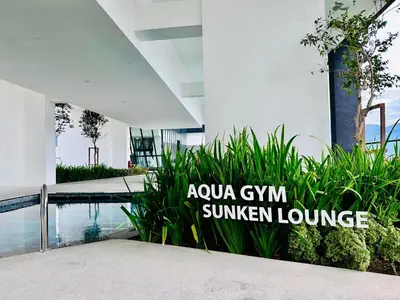 a sign that reads ayoya gym summer lounge next to a swimming pool at Stylish 3BR Retreat w Stunning Sea Views Fits 10 A29 in George Town