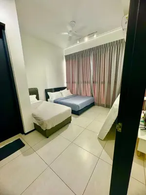 a hotel room with two beds and a window at Stylish 3BR Retreat w Stunning Sea Views Fits 10 A29 in George Town