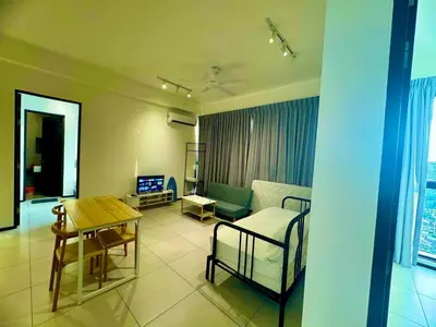 a living room with a couch and a table at Stylish 3BR Retreat w Stunning Sea Views Fits 10 A29 in George Town