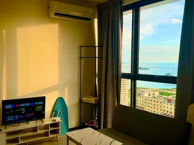 a room with a room with a view of the ocean at Stylish 3BR Retreat w Stunning Sea Views Fits 10 A29 in George Town