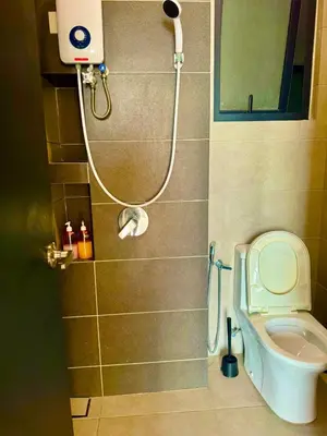 a bathroom with a shower and a toilet at Luxury 3BR Seaview Getaway Perfect for 10 Guests A29 in George Town
