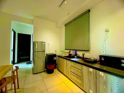 a kitchen with a large projection screen on the wall at Luxury 3BR Seaview Getaway Perfect for 10 Guests A29 in George Town