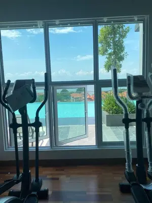 a gym with three exercise bikes in front of a window at Master Bedroom only in Bayan Lepas Share Space in Bayan Lepas