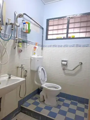 a bathroom with a toilet and a sink at Acacia Guesthouse by ZamanJa in Ipoh