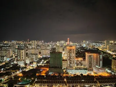 a view of a city at night with buildings at Luxe 3BR Seaview Escape Sleeps 10 Prime Location A29 in George Town