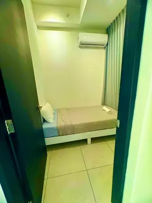 a small bedroom with a small bed in a room at 3BR Seaside Oasis Sleeps 10 Chic & Spacious A29 in George Town