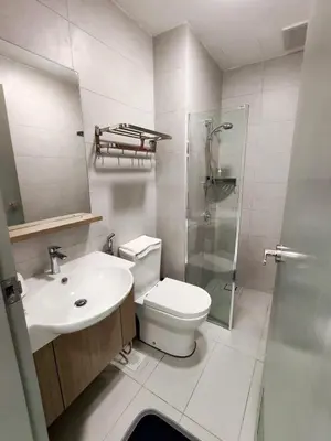 a bathroom with a toilet and a sink and a shower at Brand NEW Modern Cozy Retreats 3BR2B2P for 6 in Batu Kawan