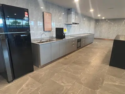 a large kitchen with a sink and a refrigerator at Brand NEW Modern Cozy Retreats 3BR2B2P for 6 in Batu Kawan